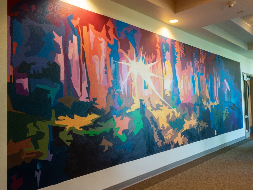A colorful mural in a hallway.
